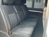 the back seat of a van with the door open and the passenger seat down