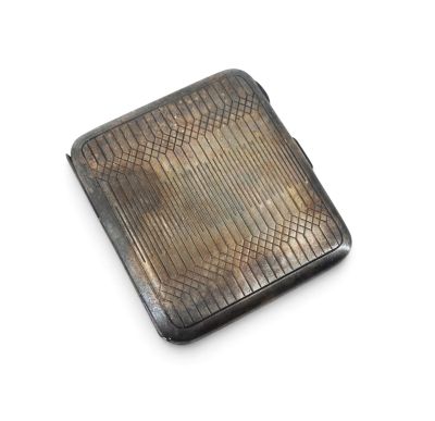 silver cigarette case on a white background with a snake skin pattern