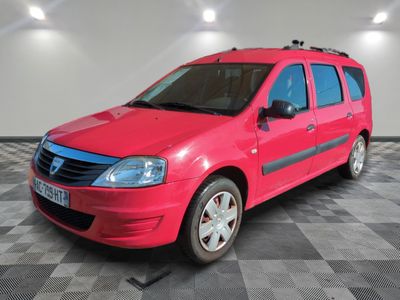 a picture of a bright red car parked in a garage