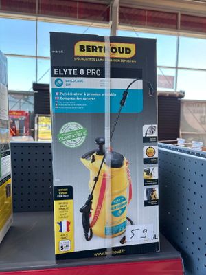 a box that has a spray gun on it in a store