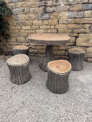 several pieces of wood are stacked on top of each other on the ground