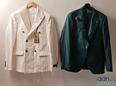 two jackets hanging on a wall next to each other