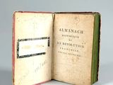 a book opened to show a picture of an old book