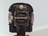 a person holding a small camera in their hand