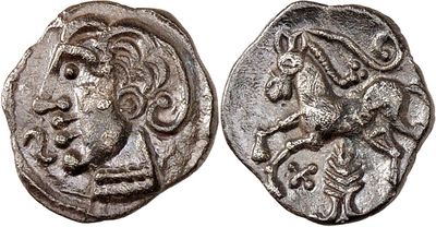 a silver coin with an image of a lion on it