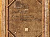 an old picture of a wooden frame with writing on it
