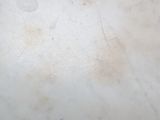 a white marble table with a black metal base