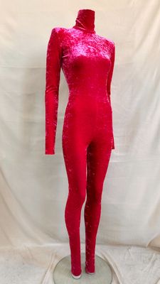 the mannequin is made of shiny red material and has a long neck