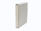 a close up of a white book on a white surface