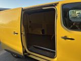 a yellow van that is parked in the parking lot