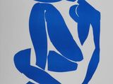blue silhouette of a man and a woman sitting on the ground