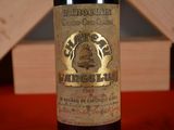 a bottle of wine that is sitting on a table