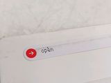 a close up of a laptop with a sticker on it