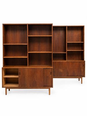 a set of three danish teak bookcases with open shelves
