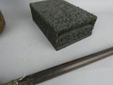 a knife and a box sitting on a table