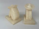 pair of white marble candlesticks on a white background