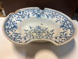 a blue and white bowl sitting on a table