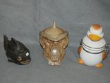 three figurines that are sitting next to each other