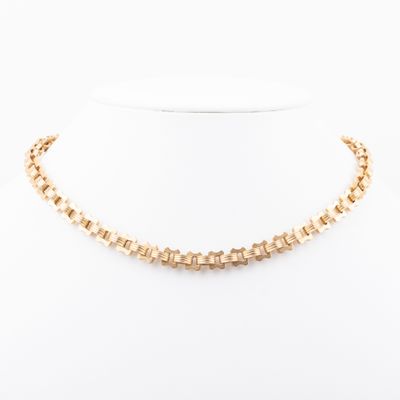 a gold necklace on a mannequin mannequin mannequin mannequin mannequin mannequin mannequin mannequin mannequin