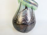 a glass vase with a ring on top of it
