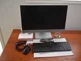 an image of a computer desk with a keyboard and mouse