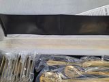 silverware in a black case with gold handles and spoons in it