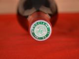 a close up of a bottle of wine on a table