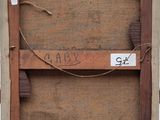 an old picture of a wooden frame with a tag on it