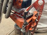 a machine that has a hose attached to it ' s side