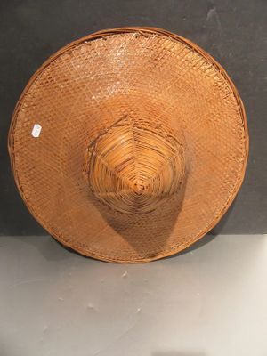 a straw hat that is sitting on top of a table