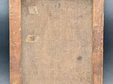 an old wooden picture frame with a black background
