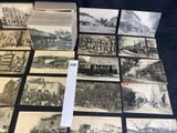 a lot of old postcards that are on the table