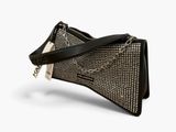 the black and white clutch bag has a chain on it