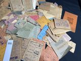 a pile of old papers on a black table