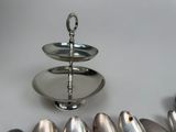 a silver plate with spoons and spoons on it