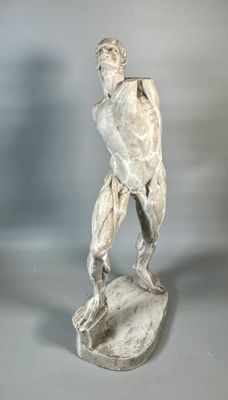 an image of a statue of a man holding a tennis racquet
