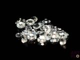 a pile of diamonds on a black surface