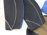 several hats are lined up on a table with a hat on top