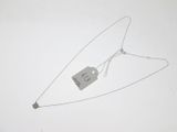 a necklace with a tag attached to it on a white surface