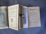 an old book opened to show pages of a book with a picture of a woman on it