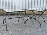 two tables that have glass tops on them on the pavement