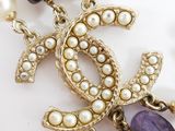a picture of a chanel necklace with pearls and amethorate