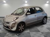 a silver car that is sitting on a checkered floor
