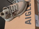 a box that has a pair of shoes on top of it