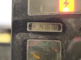 a close up of a clock on the side of a bus