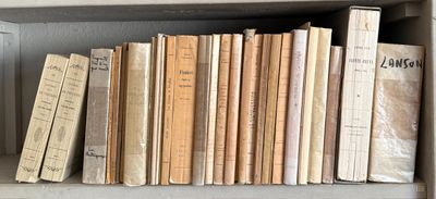 many books on the shelf in the room