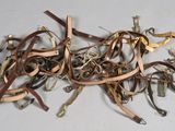 a pile of leather and metal items on a table