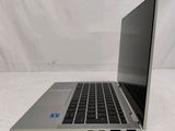 an open laptop computer sitting on top of a white surface