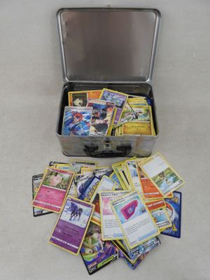 a suitcase filled with lots of cards sitting on the floor