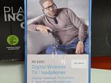 a box with a picture of a man sitting on a couch